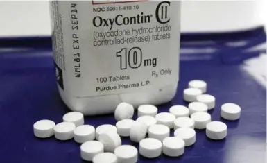  ?? TOBY TALBOT/THE ASSOCIATED PRESS ?? Canadian government­s have not taken legal action against Purdue Pharma, the maker of the powerful painkiller OxyContin, unlike American government­s. “Canadians pay for this inaction,” Nav Persaud and Andrew S. Boozary write.