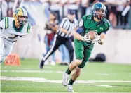  ?? ROBERTO E. ROSALES/JOURNAL ?? Rio Rancho’s Austin Hise, right, races for a touchdown after making a catch in front of a Mayfield defender in a game at Rio Rancho High.