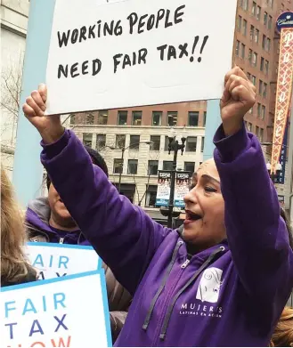  ?? TOMMCNAMEE/ SUN- TIMES ?? Frances Velez of Mujeres Latinas en Accion rallies with others for a graduated state income tax at the Thompson Center in the Loop on Tuesday.