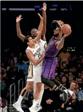  ?? AP ?? Lakers star LeBron James is marked by Pelicans defenders Frank Jackson, left, and Julius Randle yesterday.