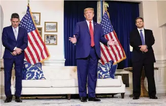  ?? ?? Former President Donald Trump speaks to the media at a Washington hotel, Tuesday, after attending a hearing before the D.C. Circuit Court of Appeals at the federal courthouse in Washington, with attorneys John Lauro, left, and D. John Sauer, right.