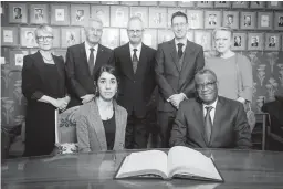  ??  ?? NOBEL LAUREATES - Nadia Murad and Denis Mukwege together with the Norwegian Nobel Peace Prize committee, Anne Enger, Thorbjorn Jagland, Henrik Syse, Asle Toje and Berit Reiss-Andersen, pose for a photograph after a news conference with the 2018 Nobel Laureates at the Nobel