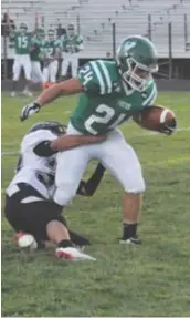  ??  ?? Moriarty's Kenneth Poyner scoring his first of two TDS against Grants, Sept. 10, 2021. Photo by Ger Demarest.