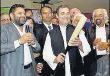  ?? HT FILE ?? Congress VP Rahul Gandhi holding a bat presented by Shudh Prakash Singh (left), president of the Indian National Overseas Congress, USA, and policy adviser Sam Pitroda (right).