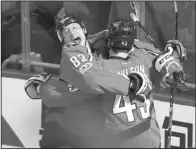  ?? AP/MOLLY RILEY ?? Washington right wing Tom Wilson (right) celebrates with center Jay Beagle after Wilson’s goal in overtime gave the Capitals a 3-2, come-from-behind victory over Toronto in Game 1 of their NHL Eastern Conference playoffs matchup Thursday night.