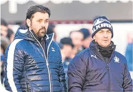  ??  ?? Paul Hartley and assistant Gordon Young are hoping to mastermind a famous cup shock