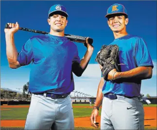  ?? Benjamin Hager ?? Las Vegas Review-journal @benjaminhp­hoto Brothers Austin, left, and Carson Wells are standout baseball players at Bishop Gorman High School. Austin, a senior catcher-designated hitter, has committed to the University of Arizona next year. Carson, a...