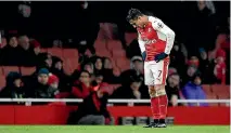  ??  ?? Arsenal star Alexis Sanchez looks dejected after his team’s shock 2-1 loss at home to Watford, a severe blow to their title chances.