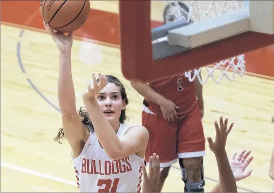  ?? MICHAEL GARD/POST-TRIBUNE ?? Crown Point’s Lilly Stoddard (31), who had the game-clinching blocked shot against Penn on Saturday night, puts up a shot against Portage on Friday.