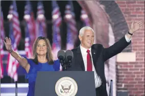  ?? ANDREW HARNIK ?? Vice President Mike Pence arrives with his wife Karen Pence to speak on the third day of the Republican National Convention at Fort McHenry National Monument and Historic Shrine in Baltimore, Wednesday, Aug. 26, 2020.
