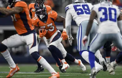  ?? Aaron Ontiveroz, The Denver Post ?? Broncos running back Javonte Williams runs against the Dallas Cowboys during the third quarter at AT&T Stadium in Arlington, Texas, on Sunday.