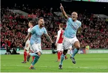  ?? GETTY IMAGES ?? Vincent Kompany celebrates his goal in the League Cup final.