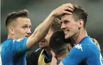  ?? — AFP ?? Napoli striker Arkadiusz Milik (right) celebrates after scoring a goal against Udinese.