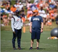  ?? ANDY CROSS — THE DENVER POST ?? Denver Broncos defensive coordinato­r Ejiro Evero, left, and head coach Nathaniel Hackett at the UCHealth Training Center August 05, 2022.