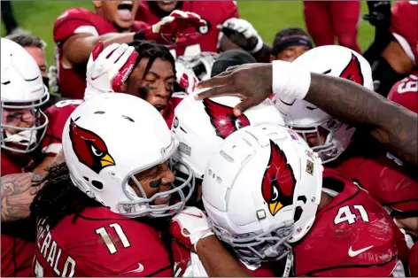  ?? AP PHOTO/ROSS D. FRANKLIN ?? The Arizona Cardinals celebrate after their game winning touchdown against the Buffalo Bills during the second half of an NFL football game, Sunday, in Glendale, Ariz. The Cardinals won 32-20.