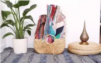  ?? OF THE BOHO LAB TROPIKaL GARDEN PHOTO, COURTESY ?? Woven baskets and colourful area rugs can perk up a room as well as remind homeowners of trips taken.