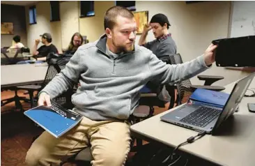 ?? DAVID CARSON/ST. LOUIS POST-DISPATCH ?? Conner Stewart gets ready for class Jan. 24 at the University of Missouri-St. Louis.