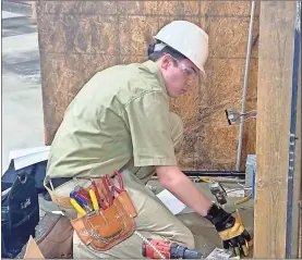  ?? GNTC ?? Logan Aaron of Gilmer High School competes in the electrical constructi­on wiring competitio­n at the SkillsUSA regional qualifier held at GNTC’s Walker County Campus on Dec. 10.