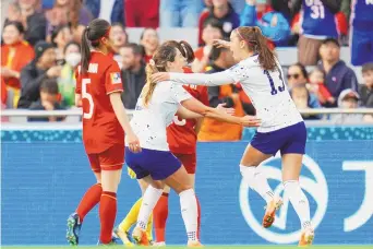  ?? ABBIE PARR/ASSOCIATED PRESS ?? United States’ Alex Morgan (13) and Savannah DeMelo (9) celebrate Sophia Smith’s first-half goal in the first-round Women’s World Cup victory over Vietnam.