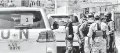  ?? ERBIN CITY VIA AP VIDEO ?? U. N. investigat­ors meet with Free Syrian Army fighters near Damascus on Thursday.