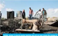  ?? — AFP ?? SHUNA, Jordan: A charred sewing machine and crib are seen among the remains of a home where several Pakistani farmers were killed in a fire yesterday.