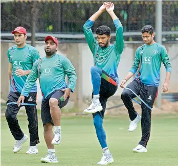  ?? — AFP ?? Afghanista­n cricketers at a practice session at the M. Chinnaswam­y Stadium in Bengaluru on Wednesday, the eve of their one-off Test against India.