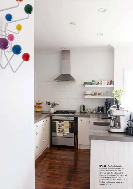  ??  ?? KITCHEN The family lived in the house during the renovation process, which saw the lino removed from the kitchen and floorboard­s polished. The colourful Eames Hang-It-All coat rack, positioned in the area between the kitchen and laundry, was one of Michael’s finds.