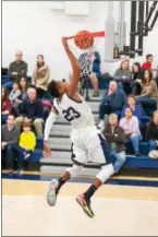  ?? SUBMITTED PHOTO - DENNIS KRUMANOCKE­R ?? Kutztown’s Lorencz Jean-Baptiste throws down a dunk during a game against Antietam last week.