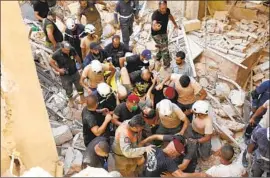  ??  ?? A SURVIVOR is removed from the rubble. The explosion, linked to a 2,750-ton store of ammonium nitrate, killed more than 100 people and injured some 4,000.