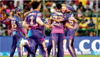  ?? — PTI ?? Rising Pune Supergiant players celebrate a wicket against Royal Challenger­s Bangalore.