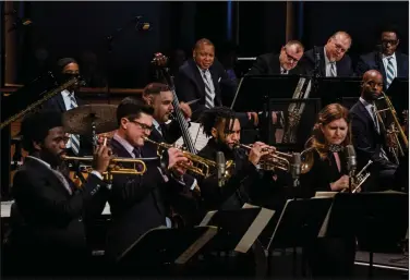  ?? (The New York Times/Gabriela Bhaskar) ?? The Jazz at Lincoln Center Orchestra and its leader, Wynton Marsalis (center rear), returned to indoor performanc­es with the Nov. 18 “Wynton at 60” event, which featured Marsalis originals and a quartet of up-and-coming trumpeters.