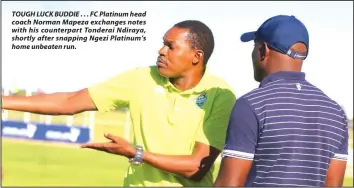  ??  ?? TOUGH LUCK BUDDIE ... FC Platinum head coach Norman Mapeza exchanges notes with his counterpar­t Tonderai Ndiraya, shortly after snapping Ngezi Platinum’s home unbeaten run.