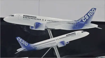  ?? PAUL CHIASSON THE CANADIAN PRESS ?? What was the Bombardier CS100 is now the Airbus A220-100, while the Bombardier CS300 is the Airbus A220-300. Models of Bombardier C Series airplanes are shown at a news conferernc­e.