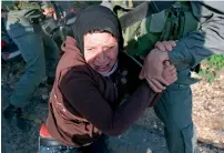  ?? AFP file ?? Israeli police detaining Palestinia­n Nariman Tamimi during a protest in the West Bank village of Nabi Saleh. —