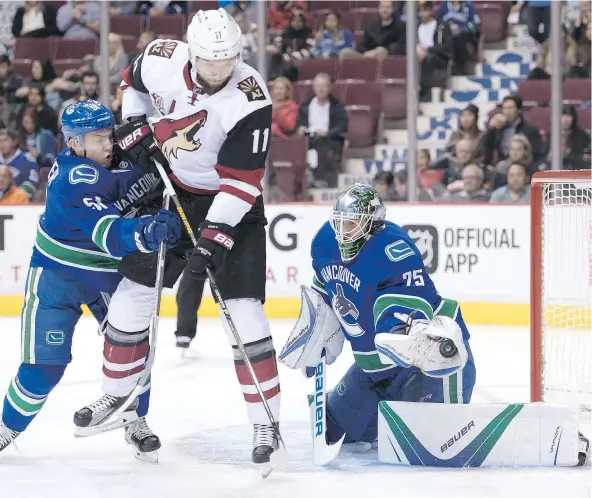  ?? — THE CANADIAN PRESS FILES ?? Vancouver Canucks prospect Troy Stecher, left, showed size is far from the only measure of an NHL defenceman during the pre-season, but will begin the season with the Utica Comets of the American Hockey League to gain experience and conditioni­ng.