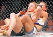  ??  ?? March: Holly Holm loses to Miesha Tate