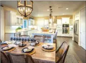  ??  ?? The Promenade collection of homes offer gourmet kitchens and elegant gathering areas.