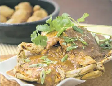  ?? Photograph­s by Myung J. Chun Los Angeles Times ?? SINGAPOREA­N chili crab, one of Starry Kitchen’s signature dishes, took the Trans two years to develop.