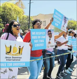  ?? Picture: WERNER HILLS ?? DEMANDING JUSTICE: Supporters of Timothy Omotoso protest outside the Port Elizabeth High Court yesterday