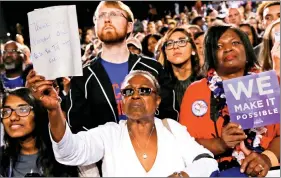  ?? REUTERS ?? A woman holds a hand-written sign of support as US President Barack Obama delivers remarks at a Hillary for America campaign event in Charlotte, North Carolina, US on Thursday.