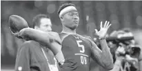  ?? MICHAEL CONROY/AP ?? Ohio State quarterbac­k Dwayne Haskins participat­es in a drill at the NFL scouting combine in Indianapol­is on Saturday.