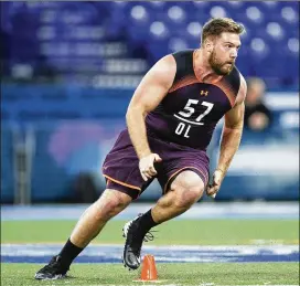  ?? JOE ROBBINS / GETTY IMAGES ?? Jonah Williams of Alabama works out during day two of the NFL Combine. “I know I can outwork and outprepare anyone,” he said.