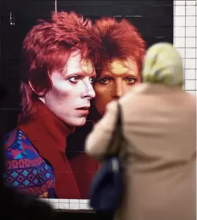  ?? —Photos: AFP ?? The Broadway-Lafayette subway station also put up a guide dubbed ‘Bowie’s Neighbourh­ood Map’ that shows sites associated with the singer including Washington Square, the park in the heart of bohemian Greenwich Village where he enjoyed strolling.