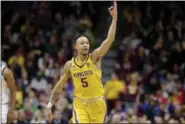  ?? NATI HARNIK - THE ASSOCIATED PRESS ?? Minnesota’s Amir Coffey (5) celebrates a three-point basket during the first half of a first round men’s college basketball game against Louisville in the NCAA Tournament, in Des Moines, Iowa, Thursday, March 21, 2019.