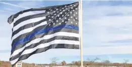  ?? DAVID ANDERSON/BALTIMORE SUN MEDIA ?? A thin Blue Line flag is displayed.