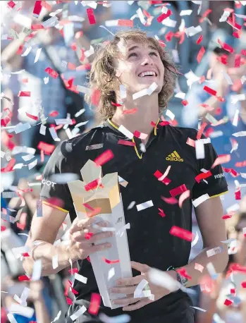  ?? PAUL CHIASSON/THE CANADIAN PRESS ?? Alexander Zverev of Germany captured his second Masters 1000 tennis title of the year, defeating all-time great Roger Federer 6-3, 6-4 Sunday in the Rogers Cup final in Montreal.