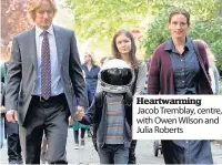  ??  ?? Heartwarmi­ng Jacob Tremblay, centre, with Owen Wilson and Julia Roberts