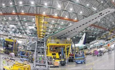  ?? "1 1)050 5&% 4 8"33&/ ?? In this file photo dated Monday, June 12, a Boeing 777 plane is shown on the assembly line in Everett, Washington. The World Trade Organizati­on on Monday rejected claims by the European Union against tax incentives provided by Washington state to...