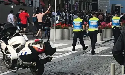  ??  ?? England fans in Porto, where police were seen charging with batons in a packed fan zone. Photograph: Sean Ingle/The Guardian