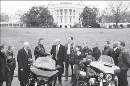  ?? STEPHEN CROWLEY / THE NEW YORK TIMES FILE (2017) ?? President Donald Trump shakes hands with Matt Levatich, CEO of Harley-davidson, during an event Feb. 2, 2017, outside the White House. Harley-davidson, the iconic American motorcycle manufactur­er, said Monday it would shift some of the production of...